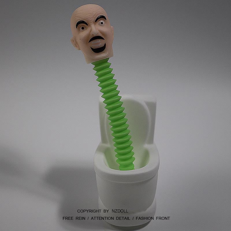 NZdoll! Bored? A little bald guy drills out of the toilet! Extendable, toy.